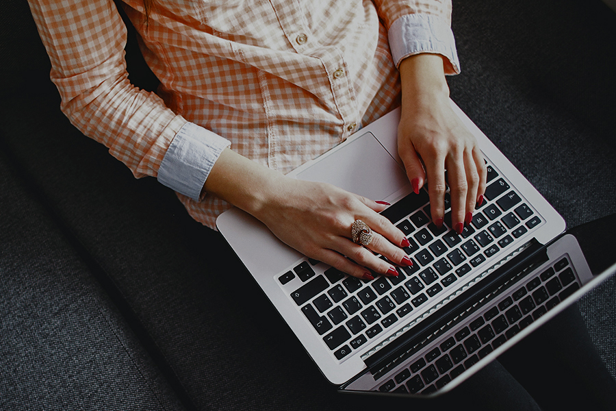 woman working on laptop computer