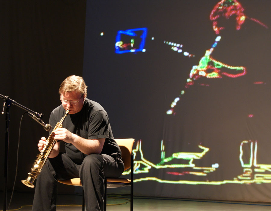 Brent Lee plays soprano saxophone during a Noiseborder Ensemble performance