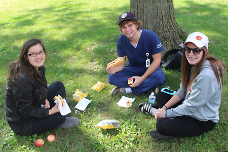 students picnic on lawn