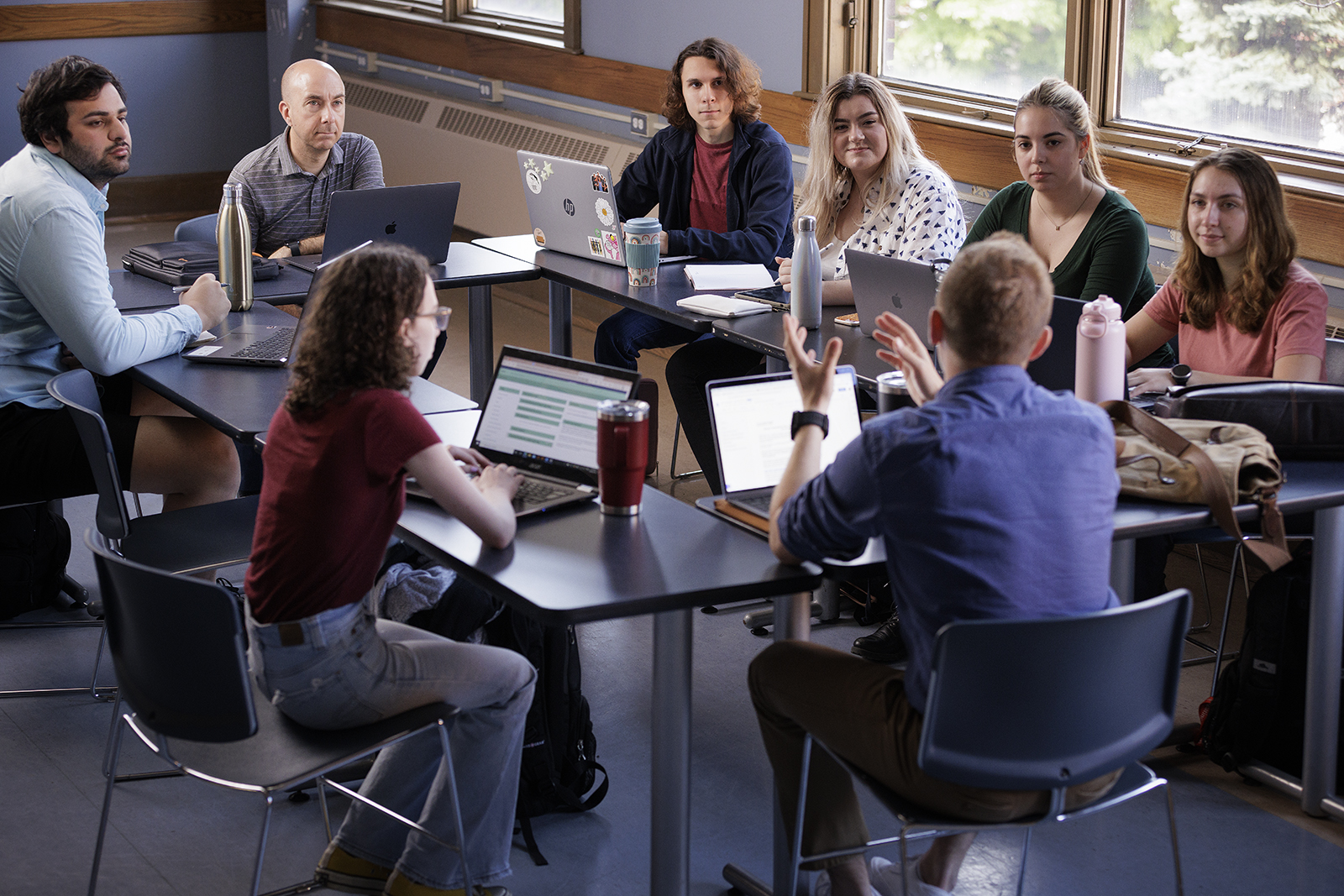 random students at meeting table