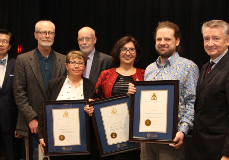 University officials congratulate winners of the UWindsor Award for Excellence in Scholarship, Research, and Creative Activity in the category of Established Scholars and Researchers: (from left) VP research and innovation K.W. Michael Siu, English professor Tom Dilworth, sociology professor Tanya Basok, acting provost Jeff Berryman, law professor Reem Bahdi, biology professor Dan Mennill, and interim president Douglas Kneale.