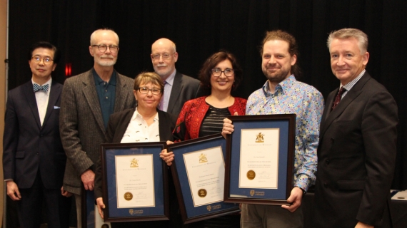 University officials congratulate winners of the UWindsor Award for Excellence in Scholarship, Research, and Creative Activity in the category of Established Scholars and Researchers: (from left) VP research and innovation K.W. Michael Siu, English professor Tom Dilworth, sociology professor Tanya Basok, acting provost Jeff Berryman, law professor Reem Bahdi, biology professor Dan Mennill, and interim president Douglas Kneale.