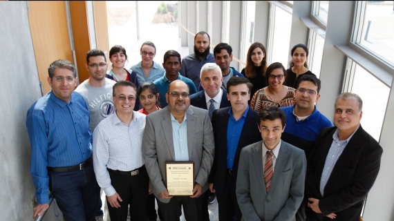 Engineering professor Mohammed Khalid, pictured centre with members of the IEEE Windsor Section, displays an award the group received under his leadership. Khalid has been elected to the executive committee of the Institute of Electrical and Electronics Engineers (IEEE) Canada.