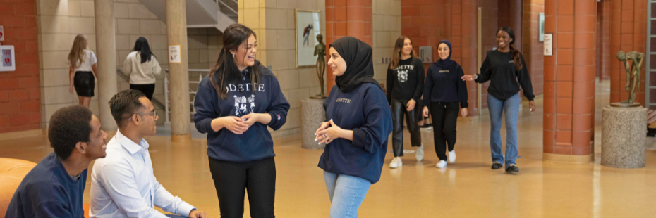 Students talking in Odette lobby