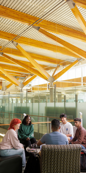 Students laugh in Engineering building.