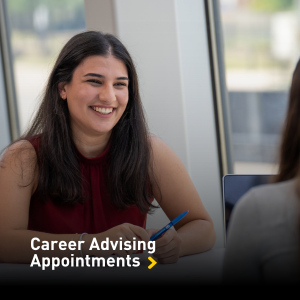 Smiling female student attending an advising appointment.