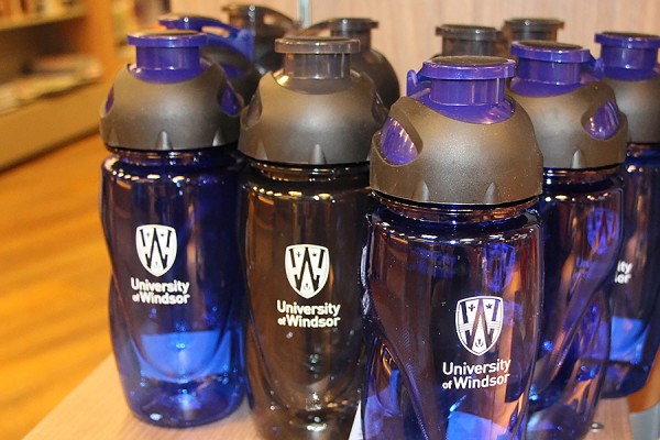 Blue and black water bottles are on sale at the Campus Bookstore. 