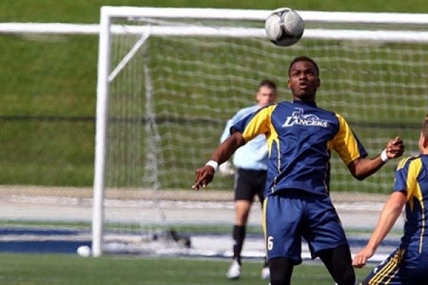 men&#039;s soccer team on the pitch