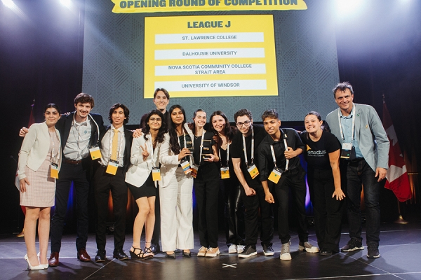 Deema Boji, Ian Trepanier, Nathaniel Pozzuoli, Hemakshi Jani, Jaden Davidson, and Hansika Khokhar with Enactus members from Dalhousie University