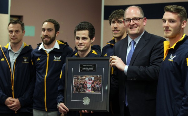 Lancer men track and field team take a group picture with Windsor Mayor Drew Dilkens, after being honoured at City Council meeting. 