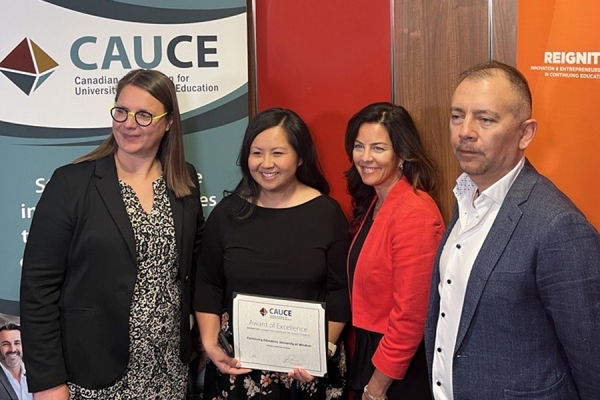 Siu Le and Jennie Atkins flanked by CAUCE officials Ewa Wasniewski and Rod Lastra.