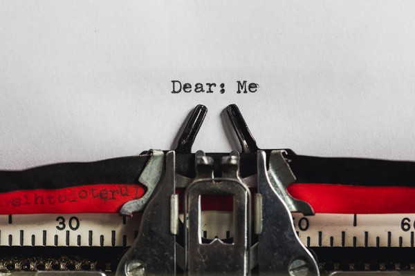Typewriter with page in it reading &quot;Dear: Me&quot;