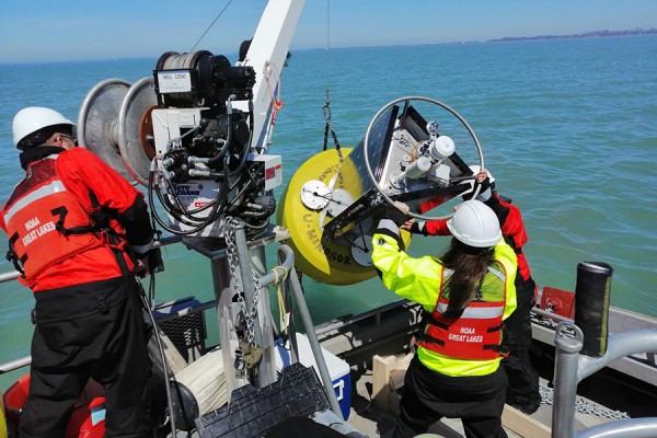 Kent Baker, Jill Crossman, Danna Palladino deploy a buoy