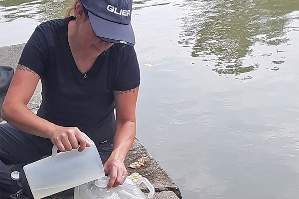 Emily Varga takes water samples