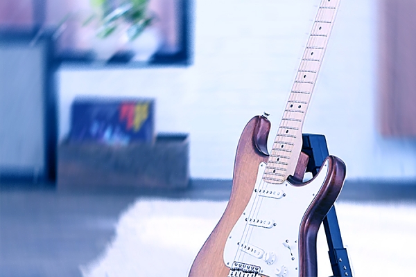 guitar leaning against wall