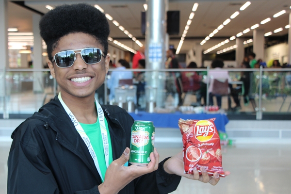 Kelvin Slaughter holds ginger ale and ketchup potato chips