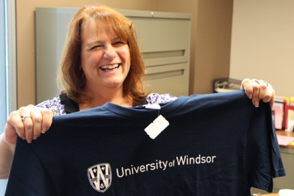 Carol Perkes shows off the T-shirt she won.