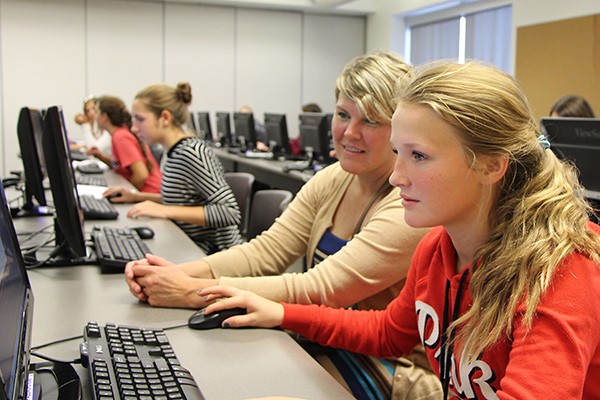 Athletes and parents complete the online portion of their baseline testing, Wednesday in a human kinetics classroom.