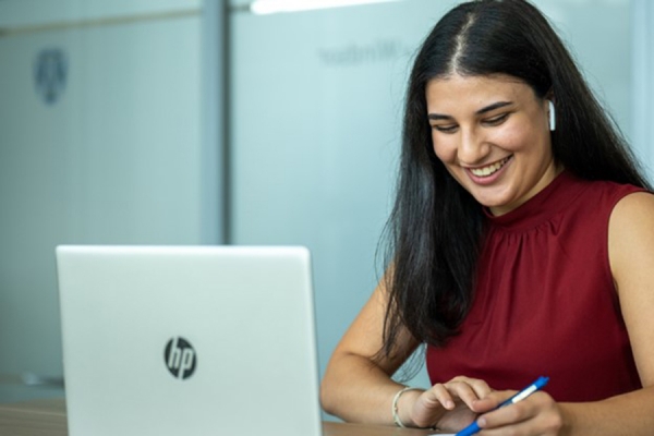 student enthusiastically taking on office work