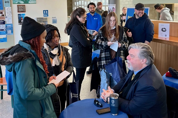 visitors speaking with Bruce Kotowich