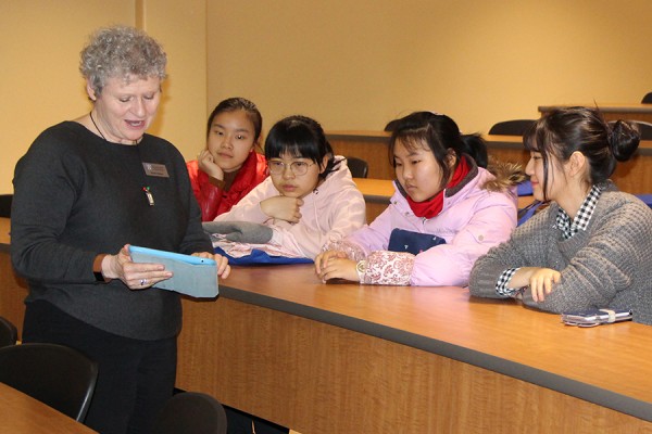 Susan McKee, communications co-ordinator for the Faculty of Arts, Humanities, and Social Sciences, describes academic programs to international students from Windsor high schools.