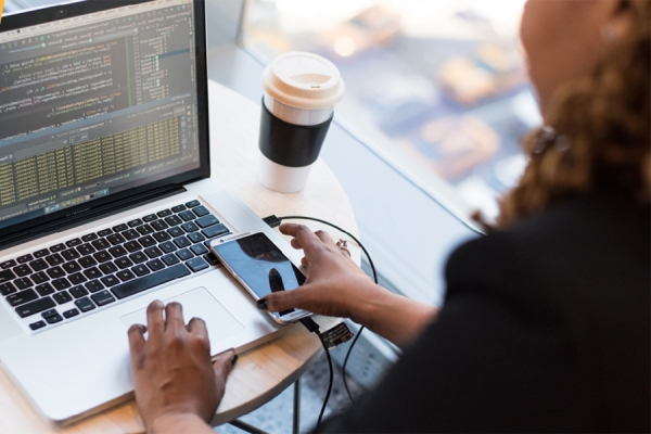 person working virtually on laptop computer