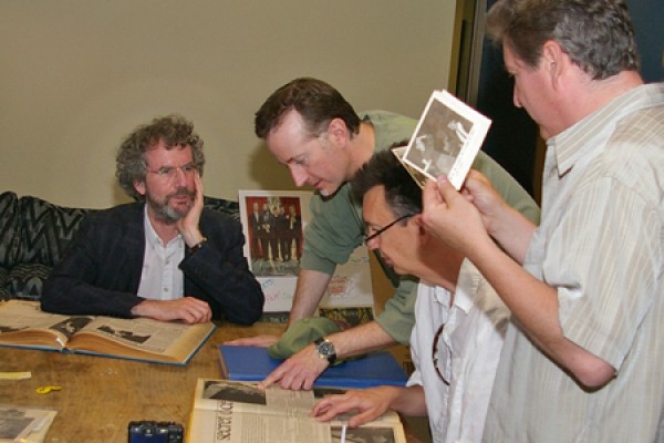 Lance alumni look through bound copies of the student newspaper