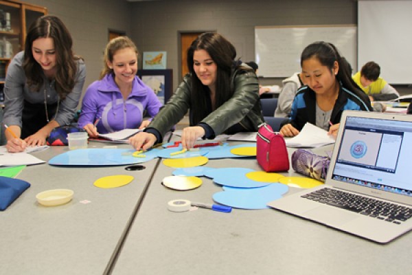 Marisa Market helps first-year biology students Emily Laughland, Tanja Spasojevic and Brenda Lao