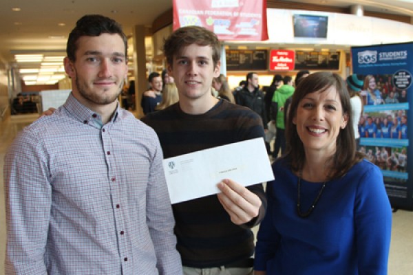 Milos Savic and Hayden Freker accept congratulations from Alisa Giroux-Souillier