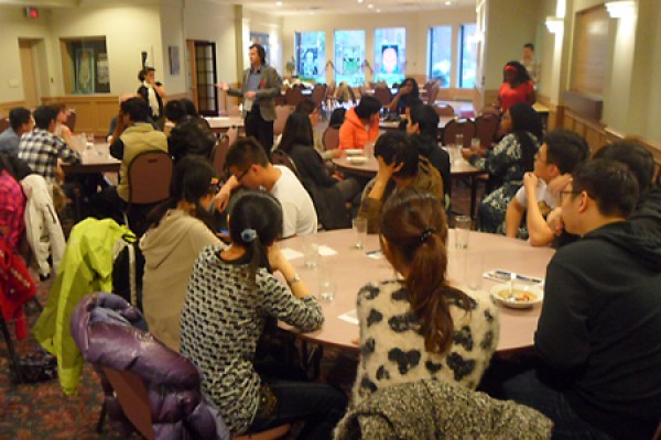 Volunteers get briefed on how to go door-to-door seeking food donations during Trick or Eat, October 31.