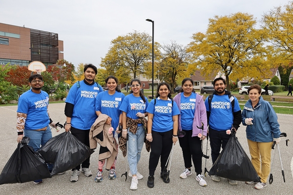 volunteers holding refuse bags