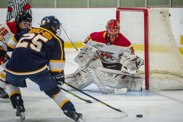 Maggi DeWolf-Russ tees up a shot on net.