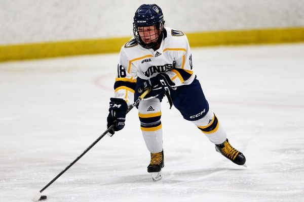 Maggie Mitani corralling puck