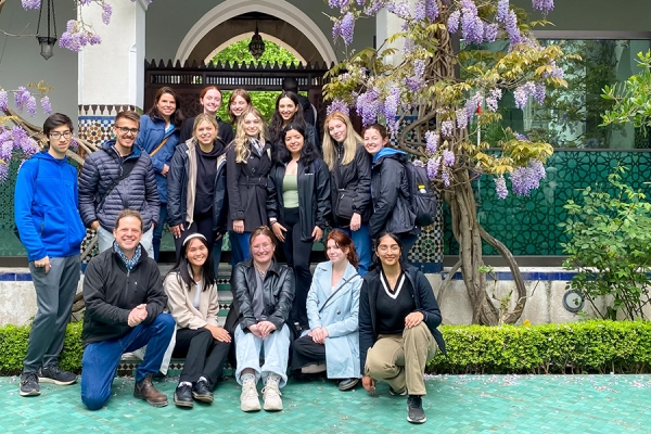 professors with students under Parisian wisteria