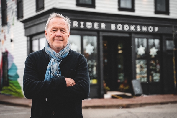 Richard Peddie standing outside River Bookshop