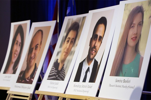 placards depicting people killed in plane crash