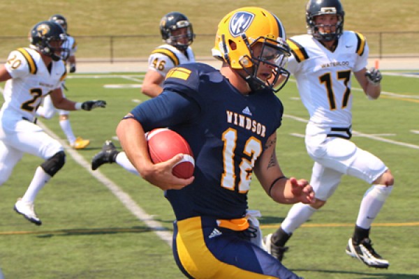 Austin Kennedy runs past Waterloo defenders