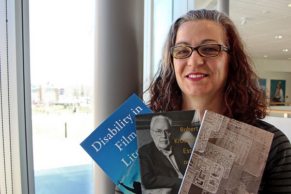 Nicole Markotić holds three of her four new books.