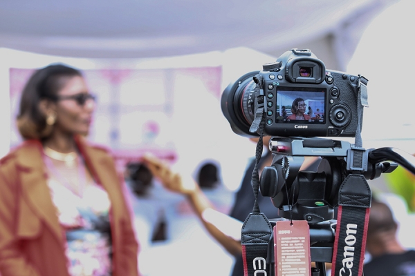 Black woman conducting on-camera interview