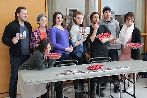 line of students holding bowls of chocolates