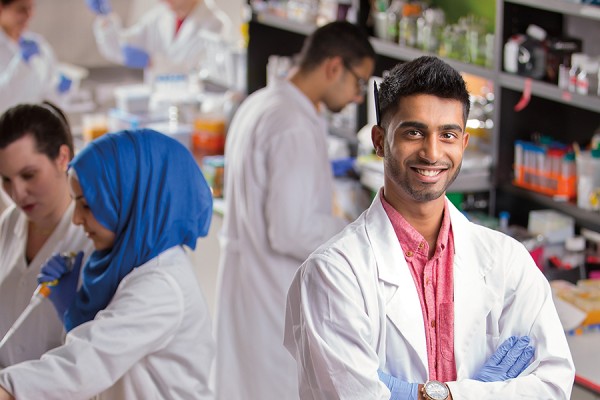 student in lab coat