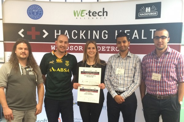 Nursing alumna Kaitlyn Sheehan (m.) and team, at Windsor-Detroit Hacking Health event. 