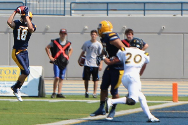 Receiver Evan Pszczonak hauls in a touchdown pass