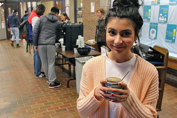 Rita Issa holding coffee