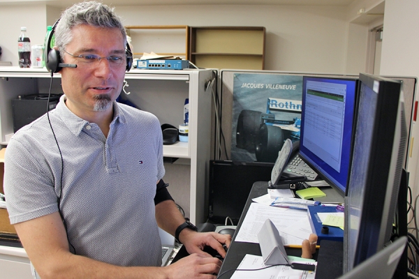 Kevin Macnaughton working at computer terminal