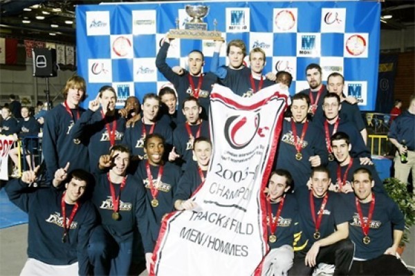 Track team holding aloft banner.