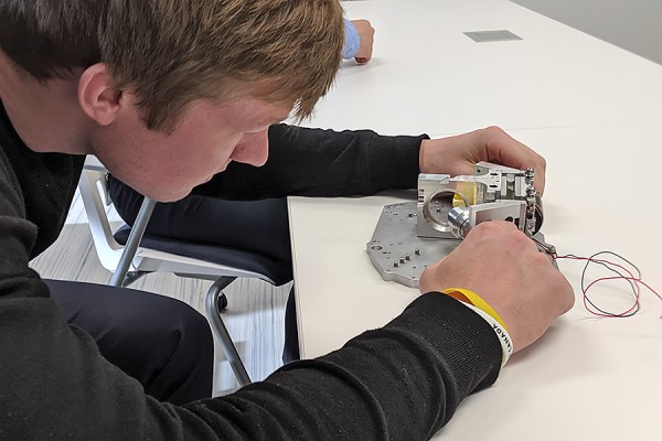 Jon Grebe inspects a spectrometric instrument