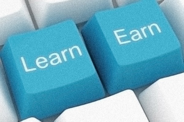 Computer keys labelled &quot;learn&quot; and &quot;earn.&quot;