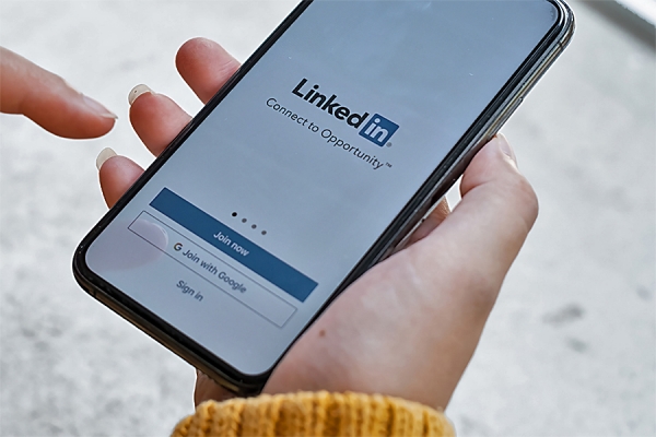 phone displaying LinkedIn app