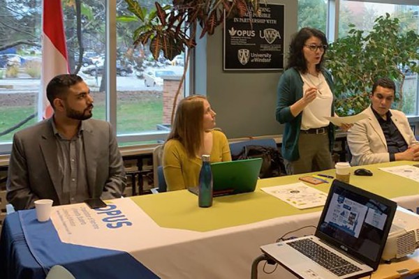 Social work professor Cynthia Stirbys speaks with students at a workshop Oct. 22 in the OPUS offices.